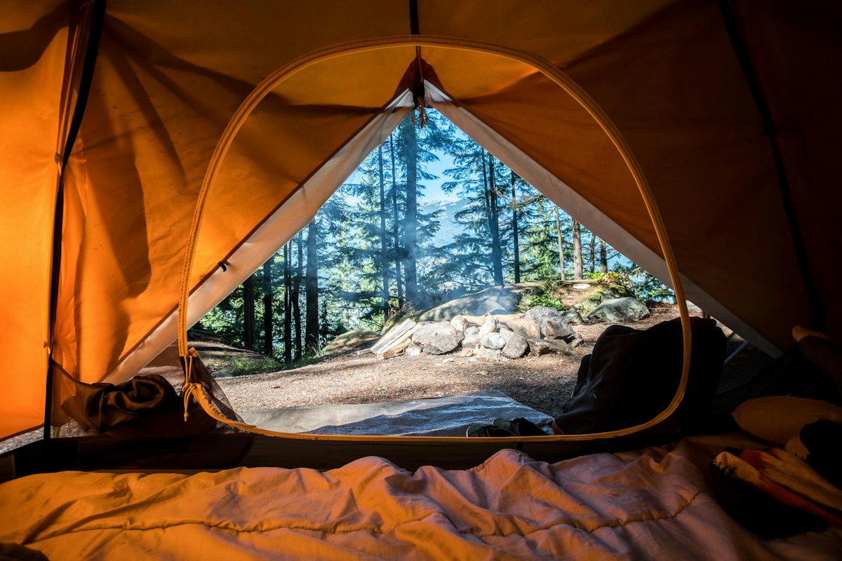 Camping Checklist for First Time Campers 2 Neatly organized budget outdoor camping equipment setup in forest