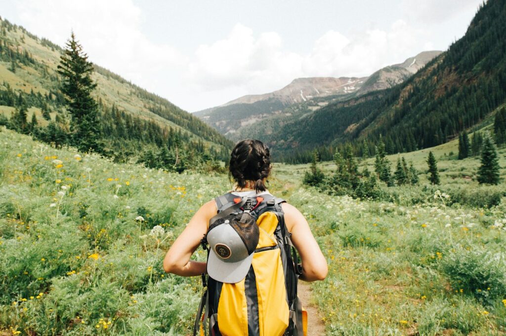 How to Pack a Backpack for Camping Correctly Hiker With Properly Packed Technical Backpack on Trail