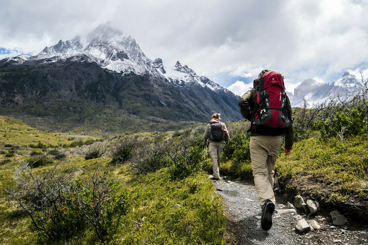 How to Read a Trail Map for Beginners 2 Hiking boots on rugged mountain trail surface