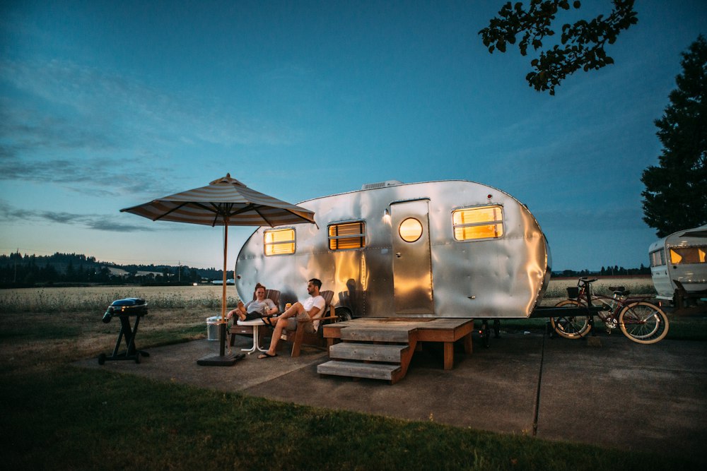How to Find a Good Campsite for Beginners 1 How to find a good campsite - Freestanding camping tent pitched safely on elevated ground near scenic lake